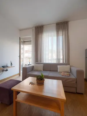 a living room with a couch and a coffee table at Seaside Rest Apartments in Budva