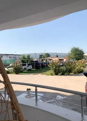 a balcony with a view of a parking lot at Apartmens Xhenis Lux in Ulcinj