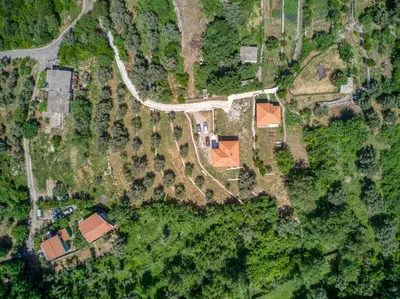 an overhead view of a yard with houses and a road at Two Bedroom House with Sea View MAJ in Ðurovići