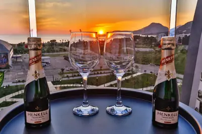 two bottles and two glasses of wine on a table at A21 LUX - Soho City Complex in Bar