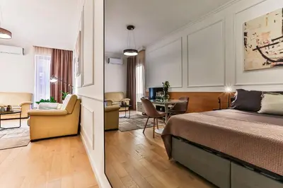 a bedroom with a bed and a living room at A21 LUX - Soho City Complex in Bar
