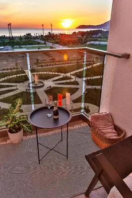 a balcony with a table and a view of a city at A21 LUX - Soho City Complex in Bar