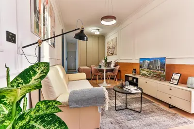 a living room with a couch and a table at A21 LUX - Soho City Complex in Bar