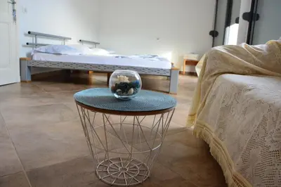 a table with a bowl on it in a room at NEXT DOOR HOUSE in Ulcinj