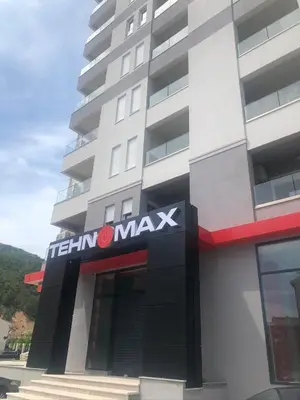 a building with a sign on the side of it at Anja Lux Apartman in Budva