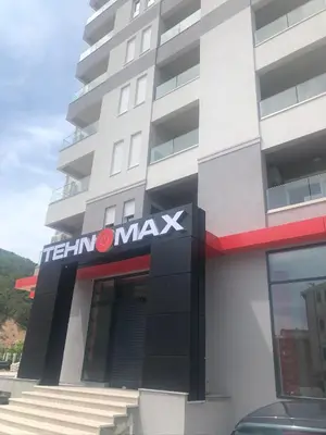 a building with a sign on the front of it at Anja Lux Apartman in Budva