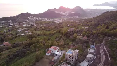 an aerial view of a town in the mountains at AparDibra in Bar
