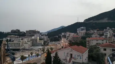 a view of a city with buildings and mountains at Sea View Studio in Becici