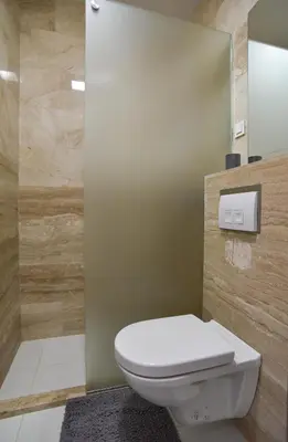 a bathroom with a toilet and a shower at Apartment in the luxury hotel near beach in Budva