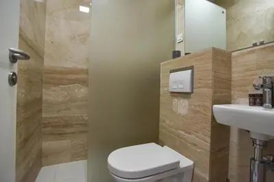 a bathroom with a toilet and a sink at Apartment in the luxury hotel near beach in Budva