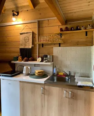 a kitchen with a sink and a counter top at Cabin House Dubovik in Cetinje