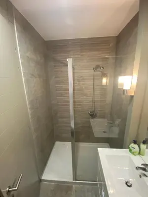 a bathroom with a shower and a sink at 18th Century Villa in the UNESCO Bay of Kotor in Kotor