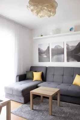 a living room with a couch and a coffee table at Laurel Apartments in Bar