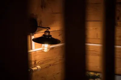a light hanging from a wall with a window at Madre Natura Glamping in Ulcinj