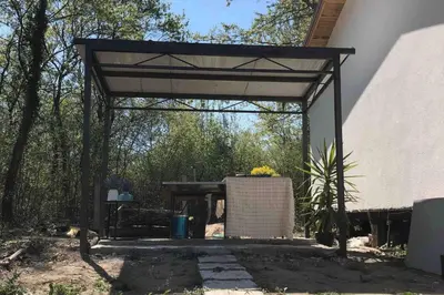 a pavilion with a table and a picnic table at Rajana Bungalow - Ulcinj in Ulcinj