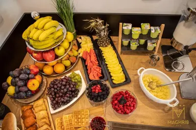 a table with many different types of fruits and vegetables at Maghrib Hotel in Ulcinj