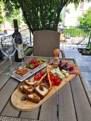a tray of food on a table with cheese and meats at Luxury Boutique Studio in Budva