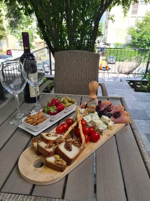 a tray of food on a table with cheese and meats at Luxury Boutique Studio in Budva