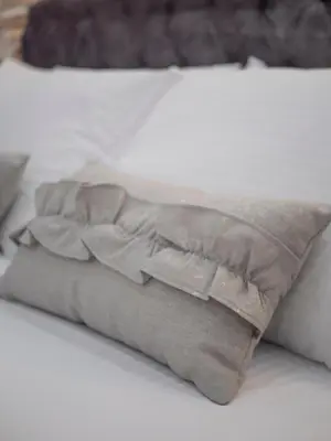 a pillow sitting on top of a bed at Luxury Boutique Studio in Budva