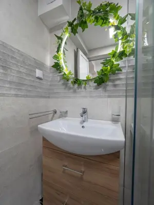 a bathroom with a sink and a mirror at Luxury Boutique Studio in Budva