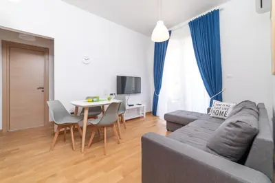 a living room with a couch and a table at Ana`s apartment Budva MNE in Budva