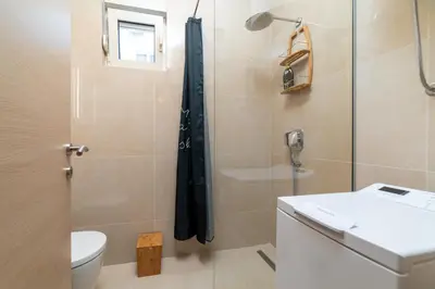 a bathroom with a shower and a toilet and a sink at Ana`s apartment Budva MNE in Budva