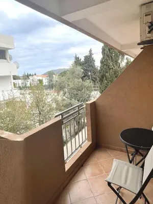 a balcony with a table and chairs and a view at Garni Hotel S Coast in Budva