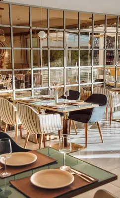 a dining room with a table and chairs at Status-M Apartments 174 in Becici