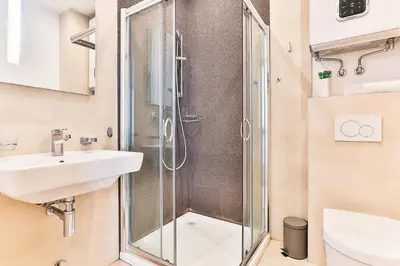 a bathroom with a shower and a sink at Lux Panorama in Budva