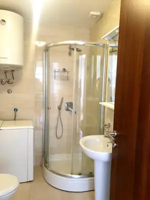 a bathroom with a shower and a sink at City & Sea Apartment nearby Old Town in Budva