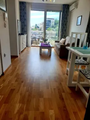 a living room with a couch and a table at City & Sea Apartment nearby Old Town in Budva