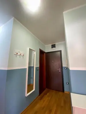 an empty hallway with a door and a mirror at Apartment Center Adria in Bar
