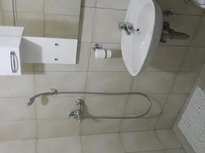 a shower with a toilet in a bathroom at Mena apartmani in Budva