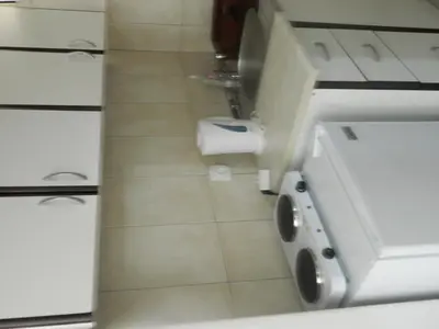 a white bathroom with a toilet and a sink at Mena apartmani in Budva