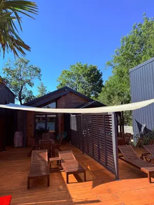 a wooden deck with chairs and a pavilion at Ada Bojana Beach House I XXL TerraceI BBQ I Betw BridgeBeach I Air Con in Ulcinj