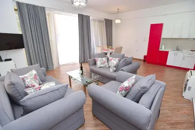 a living room with two couches and a table at Victoria Center Apartments in Budva