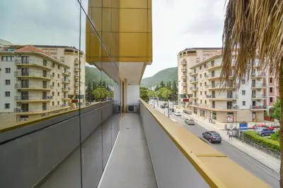 a balcony with a view of a street and buildings at Victoria Center Apartments in Budva