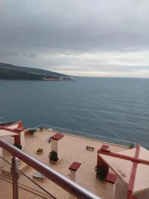 a view of the ocean from a balcony at Bella Costa in Dobra Voda
