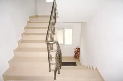 a staircase in a house with a metal railing at Apartments Sejla in Ulcinj