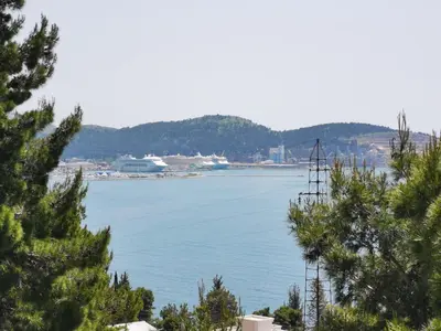 a view of a large body of water with trees at Green Pino Seaview Studios in Bar