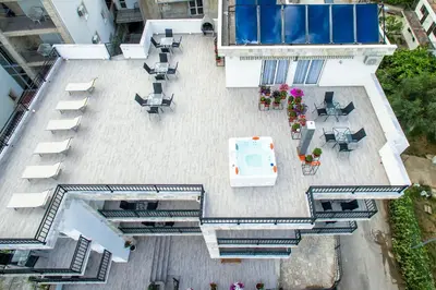 an overhead view of a patio with tables and chairs at Apartments Sarić in Bar