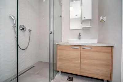 a bathroom with a sink and a shower at Soho City A403 in Bar