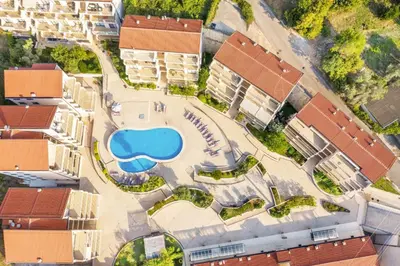 an overhead view of a building with a swimming pool at Blue Horizon Lux Apartment with Pool in Sveti Stefan