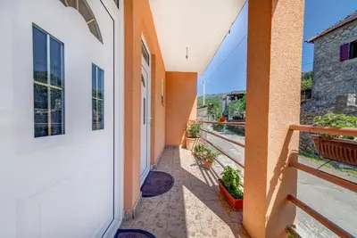 a hallway of a house with a door at Pristan Apartments in Dodoši