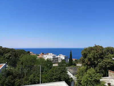 a view of the ocean from a city at Apartman Kosta in Utjeha
