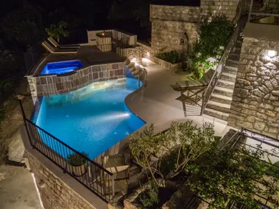 an overhead view of a swimming pool at night at Vila Stari Mlin in Ivanovići