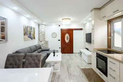 a living room with a couch and a table at Apartmani Vukčević in Bar