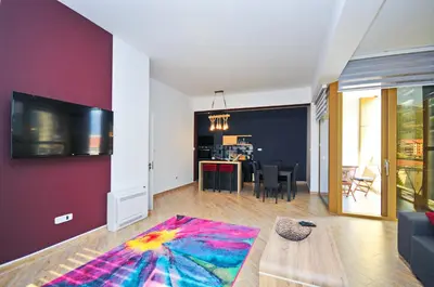 a living room with a couch and a table at Orange Lux Apartments in Budva