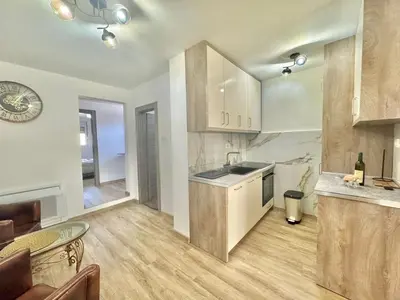 a kitchen with a sink and a counter top at Maxim Family Apartment Budva in Budva