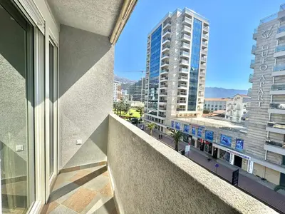 an apartment balcony with a view of a city at Maxim Family Apartment Budva in Budva